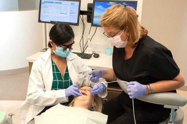 Freehold dentist Dr. Prachi Shah performing root canal procedure at Premier Arts Dental