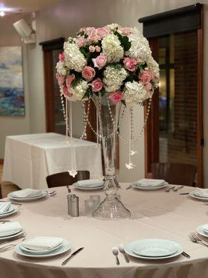 Large Table arrangement with hanging crystal and orchids.