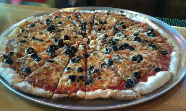 Pizza with black olives and homemade sausage