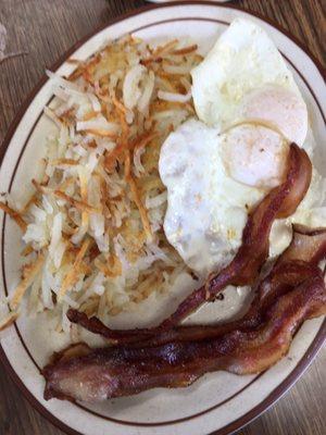 The Old #2, eggs over easy, bacon & crispy hash browns with wheat toast.