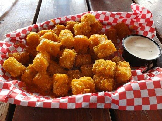 Huge size for a side order. If you want cheesy tots, they will do either nacho cheese or melted cheddar cheese.