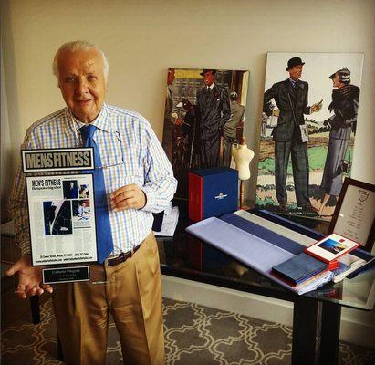 Master Tailor, Umberto Pitagora holding his 'Bespoke big shot' article, written and published by Men's Fitness.