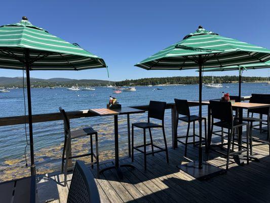 Tables at the waters edge, a great view of the harbor.