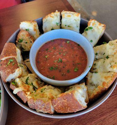 Garlic cheese bread on house baked baguette comes w/pomodoro for dipping