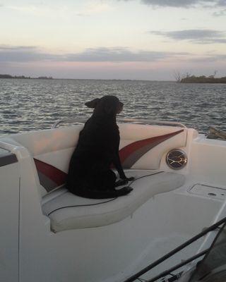 Ilia watching the sunset from our boat.