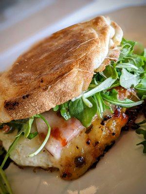 Killer English muffin sandwich with egg, bacon jam, Canadian bacon, cheese and arugula.  Taste sensation!