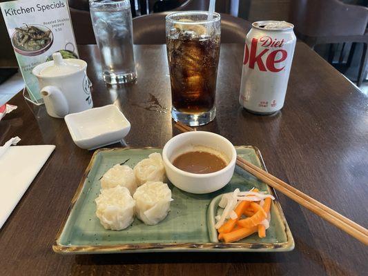 Shrimp Shumai with a vinaigrette sauce.