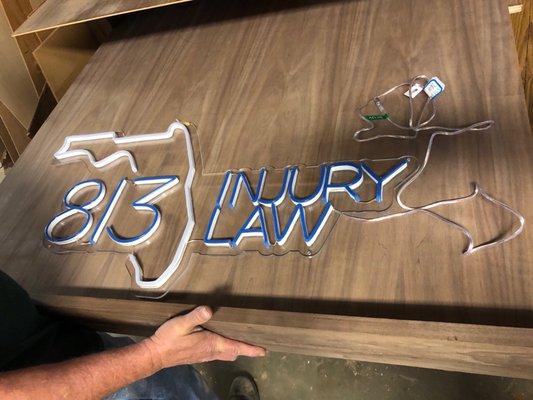 Getting a frame made for our company's neon sign