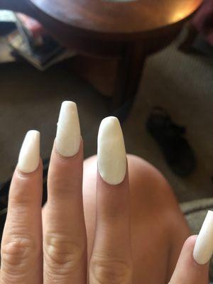 the replaced nail is the right ring finger and obviously doesn't look anything like the other