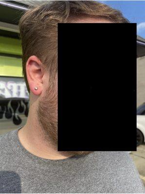 My husband's lobe piercings (right side), super painless and quick!