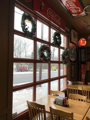 Interior Xmas wreaths with views of tractors