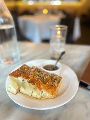 House bread, olive tapenade, and bottle of house water