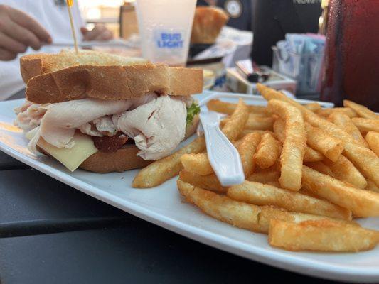 Turkey Club Sandwich and fries