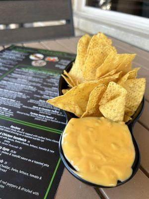 Complimentary chips and queso.