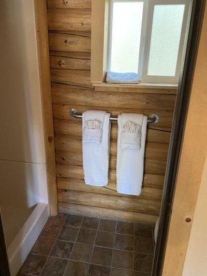 Private shower and toilet, plus cute lil towel setup