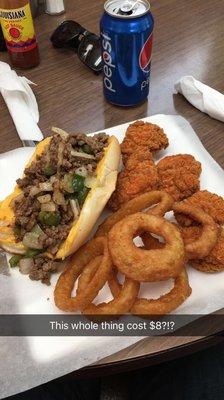 The Mr. B's Cheesteak and a basket of Boneless Buffalo Wings. Comes with onion rings and a can of Pepsi.