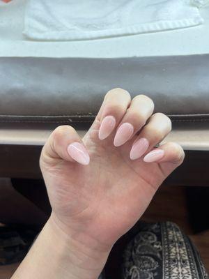 A gel manicure with an extension: she added a nail tip and then sealed it with dip powder layers and then painted it gel.