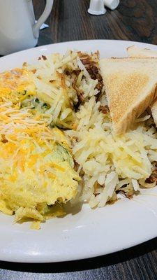 Shrimp omelet with has browns and toast