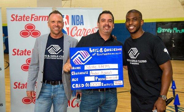 State Farm, The NBA Cares, and The Chris Paul Family Foundation making a donation to the Andre Agassi Boys & Girls Club