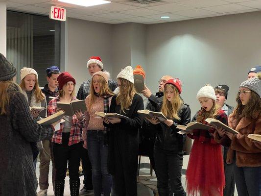 Caroling in the lobby, The teens at ET can really sing!