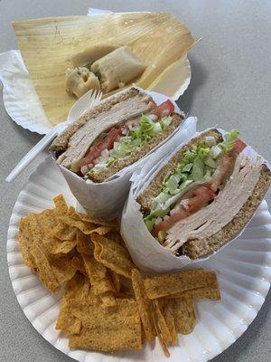 Turkey sandwich on wheat toasted with some sunchips and a jalapeño and cheese  tamales