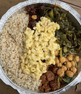 Large portion. Clockwise from top: BBQ, collard greens, chickpeas, sweet & sour, brown rice and mac and cheese on top.