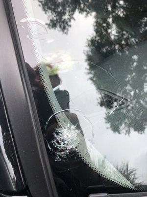 Damage to my windshield caused by their truck.