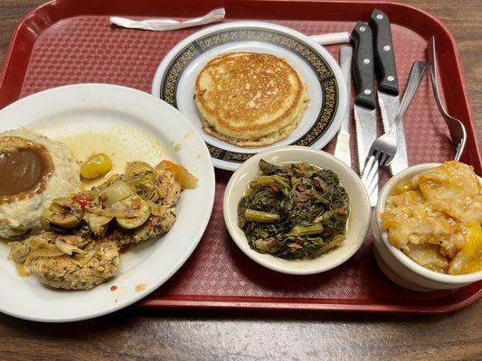 Chicken breast with mashed potatoes, greens, Mac n cheese and cornbread