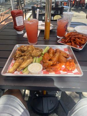 Sweet Potato Fries buffalo wings garlic Parmesan wings Malibu with pineapple & cranberry Outside area.