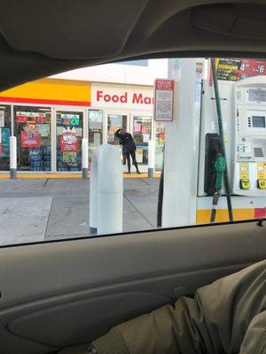 Customer waiting outside because the doors are locked during business hours.