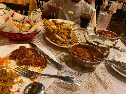 Goat Biryani, Chicken Curry, Fish Vindaloo, Garlic Naan Bread