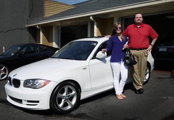 Sales Consultant Michael with client Jessica, picking up her BMW 135i!