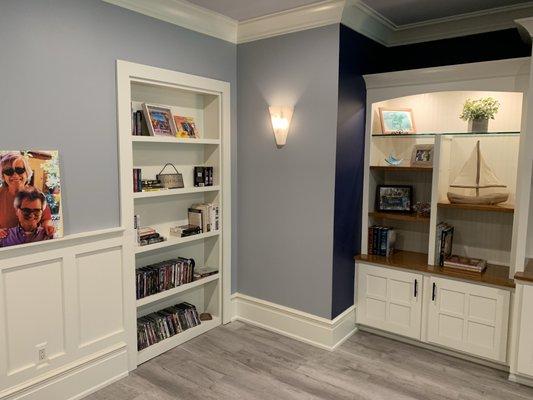 A beautiful basement remodel with its own reading area.