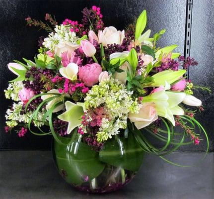 This lavish Spring mix features Peonies, Lilacs, Hyacinths, Roses, Tulips, Calla Lilies & Crystal Blancas. www.DeluxeFlorist.com