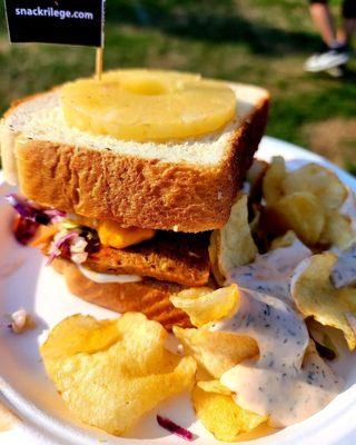 Vegan Buffalo wing sandwich with chips and homemade blue cheese