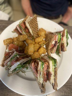 Club sandwich with tater tots.