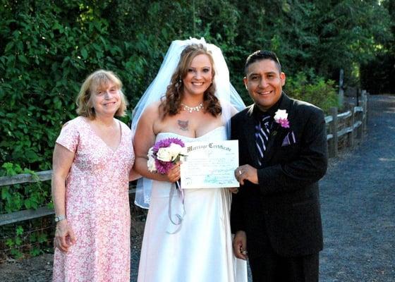 Ana Villarqui, bi-lingual officiant with yourpersonalceremony.com, with happy Spanish-American wedding couple