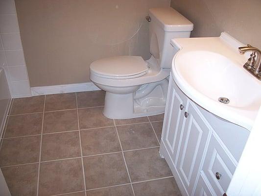 bathroom remodel, tile floor, new toilet and vanity