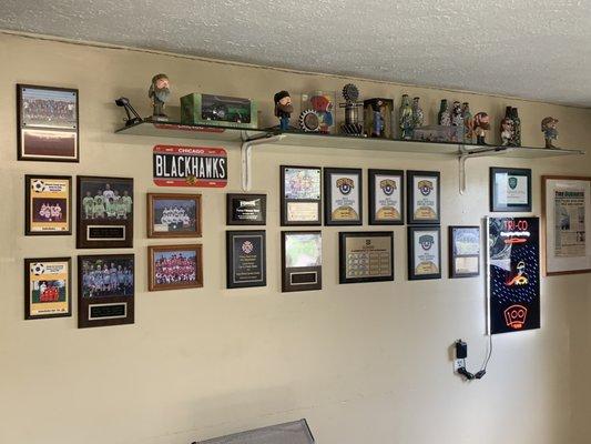 Interior right wall of entry with MANY awards!