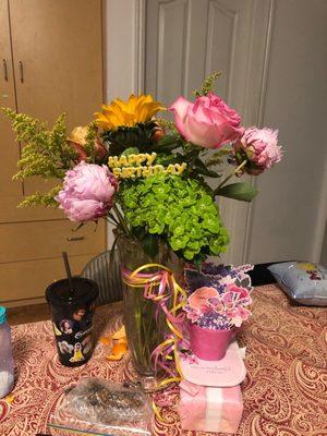 Lovely peonies hydrangeas and pink roses with sunflowers