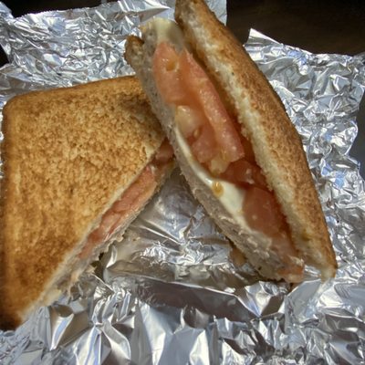 Tuna Sandwich with tomato and cheese.