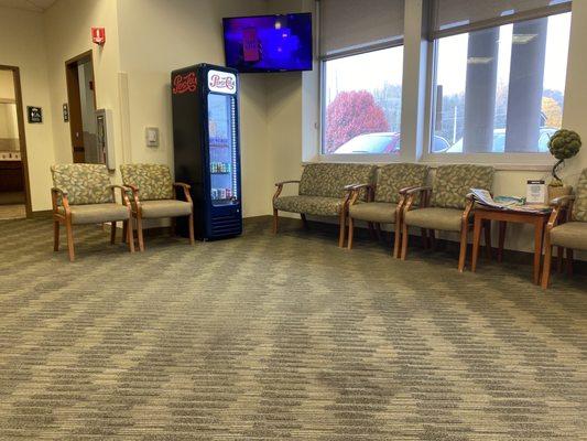 Main waiting room with drinks while you wait