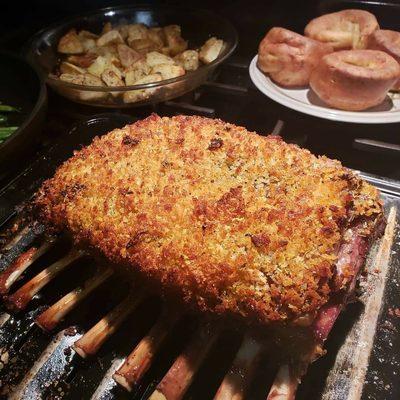 Mustard and panko crusted rack of lamb popovers in the backround