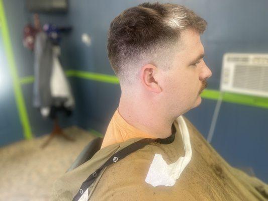 Close Dropped Light Fade haircut done at Fades & Arches Barbershop