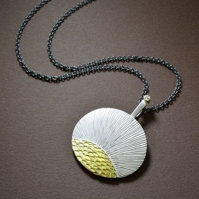 A beautifully crafted pendant in silver and gold, by Susan Mahlstedt.