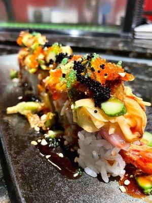 DINKY 14.95 [shrimp tempura, spicy tuna] Hamachi, onions, jalapeño, asparagus, spicy aioli, unagi sauce, garlic chip & tobiko