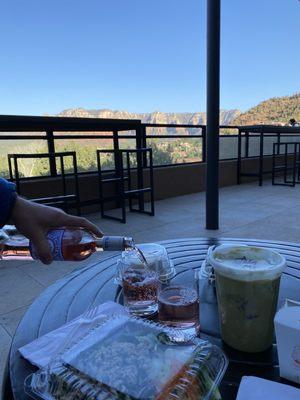 Larb and green curry takeout with a view