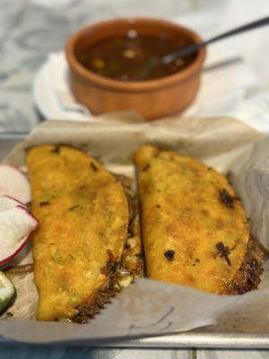 Birria tacos with consommé