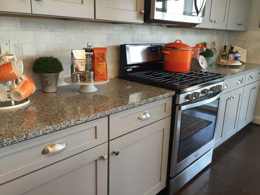 Granite top with an eased edge fabricated and installed by Designer Surfaces.