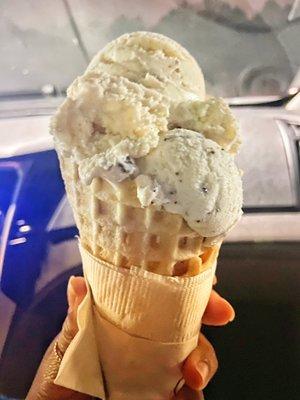 Butter pecan and Chocolate chip ice cream in a waffle cone.